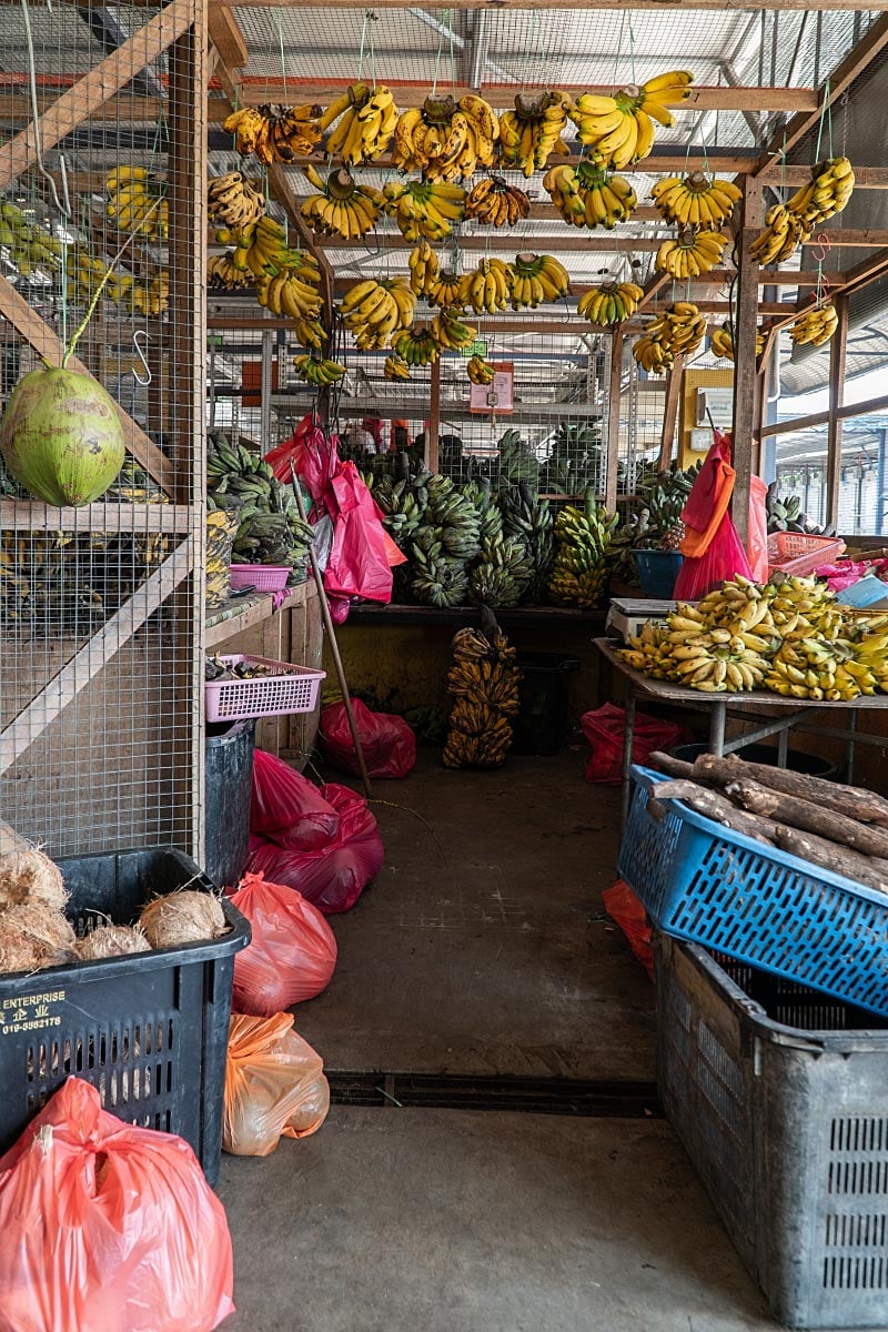 Banana stall and market aisle at Pasar Besar Melaka